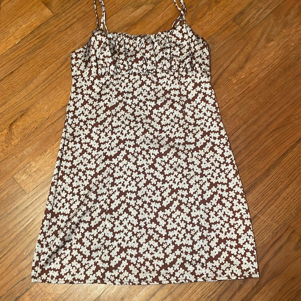 Brown dress with blue flowers. Never worn. Got at PacSun (brand is L.A. hearts)